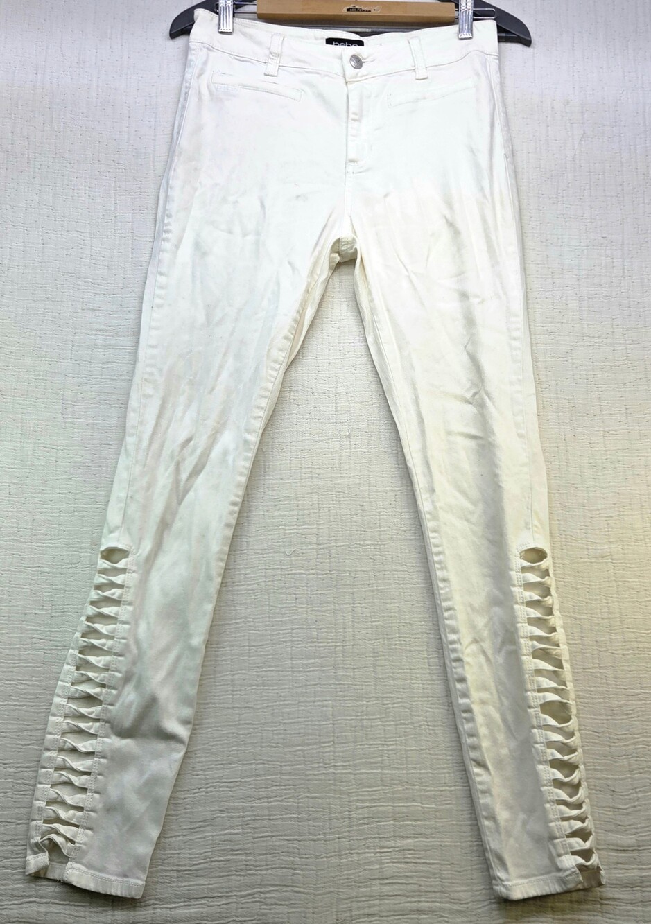 bebe White Skinny Jeans with Cut-Out Lattice Detail Good Condition